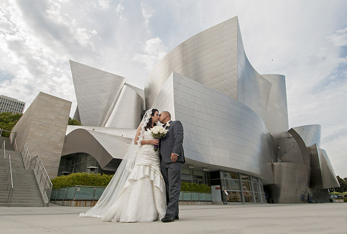 Daisy and Martin share a kiss on their wedding day in front of the Disney Concert Hall in Los Angeles, CA on June 27, 2015.